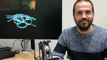 Music - Gennaro Notomista, a University of Waterloo , with one of the robots that creates paintings inspired by music. Music